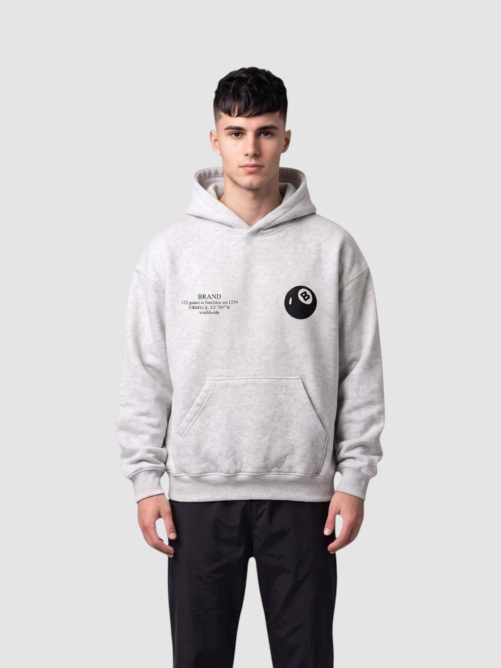 Y2K Studio grey heathered boxy hoodie with 8-ball chest logo and kangaroo pocket worn by a male model