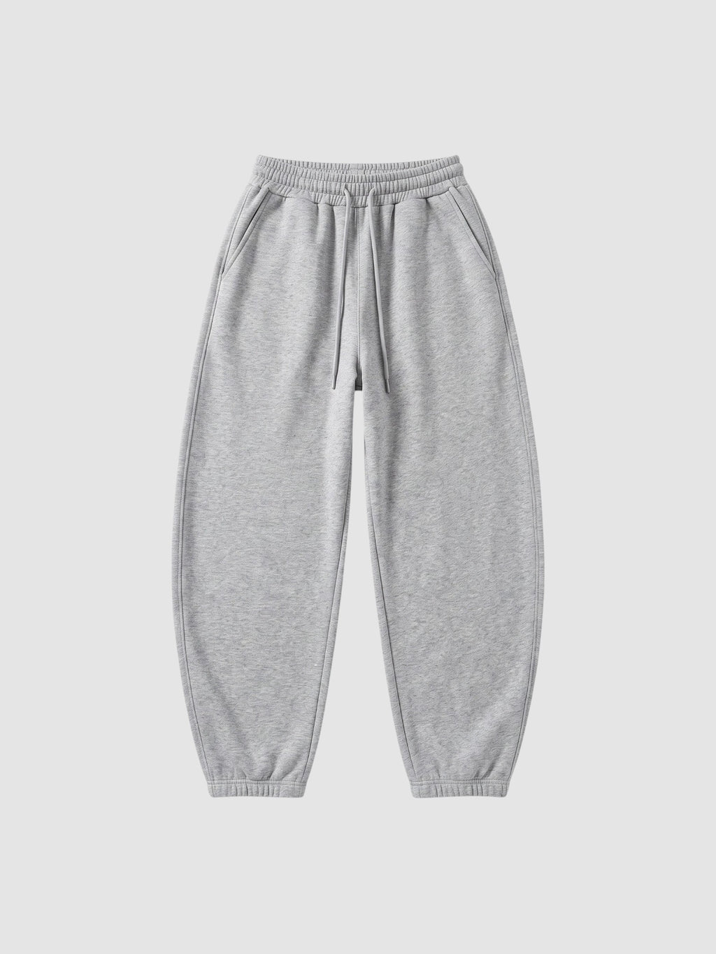 Y2K Studio grey barrel leg sweatpants with a high elastic waist, drawstring, and deep side pockets.