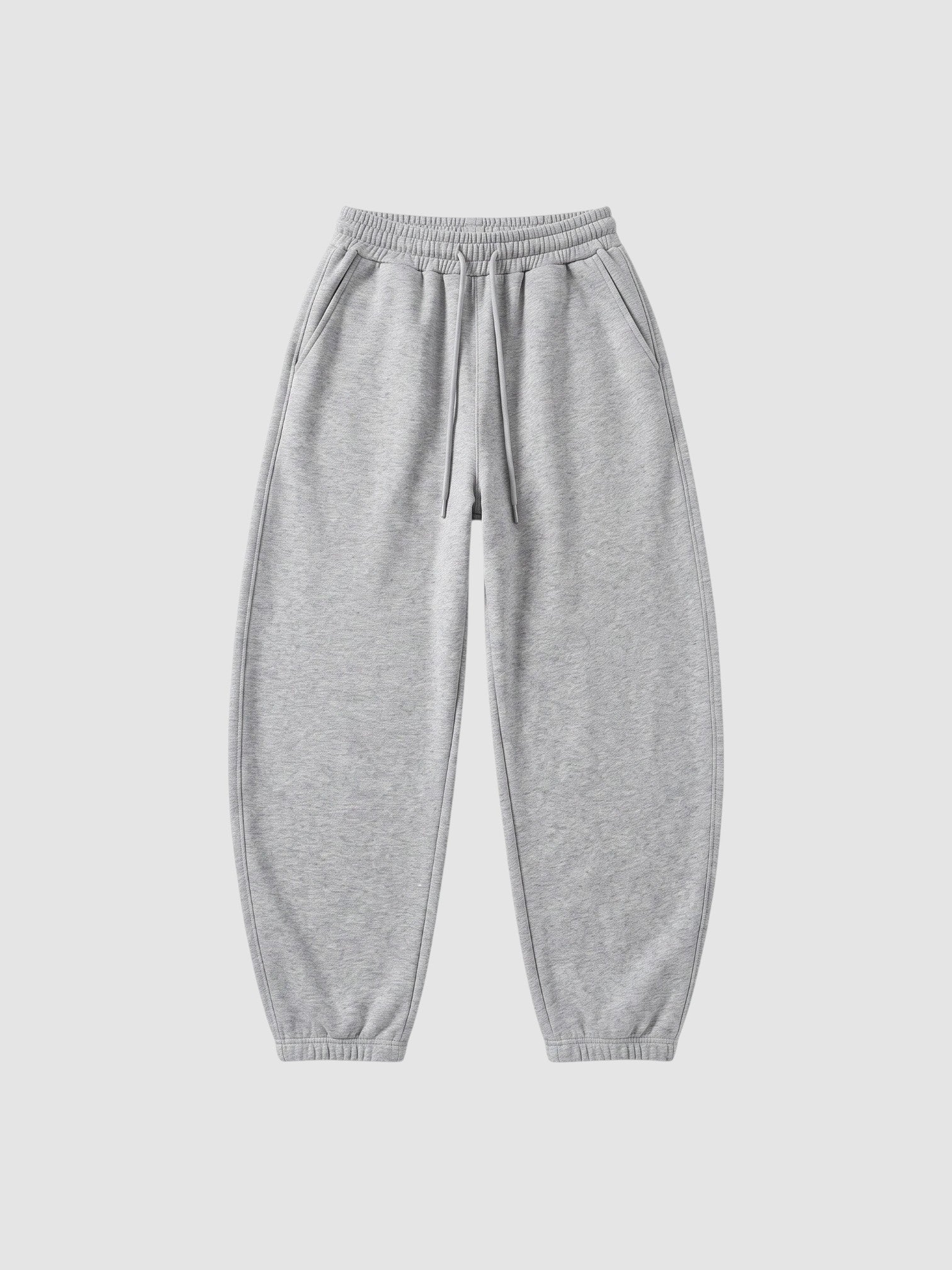 Y2K Studio grey barrel leg sweatpants with a high elastic waist, drawstring, and deep side pockets.