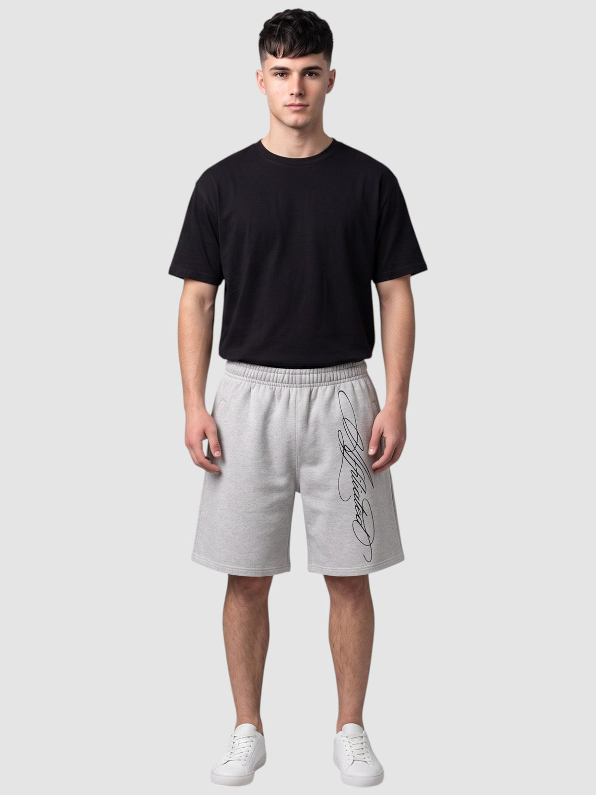 Y2K Studio grey fleece shorts with black cursive calligraphy print, featuring an elastic waist and relaxed fit.