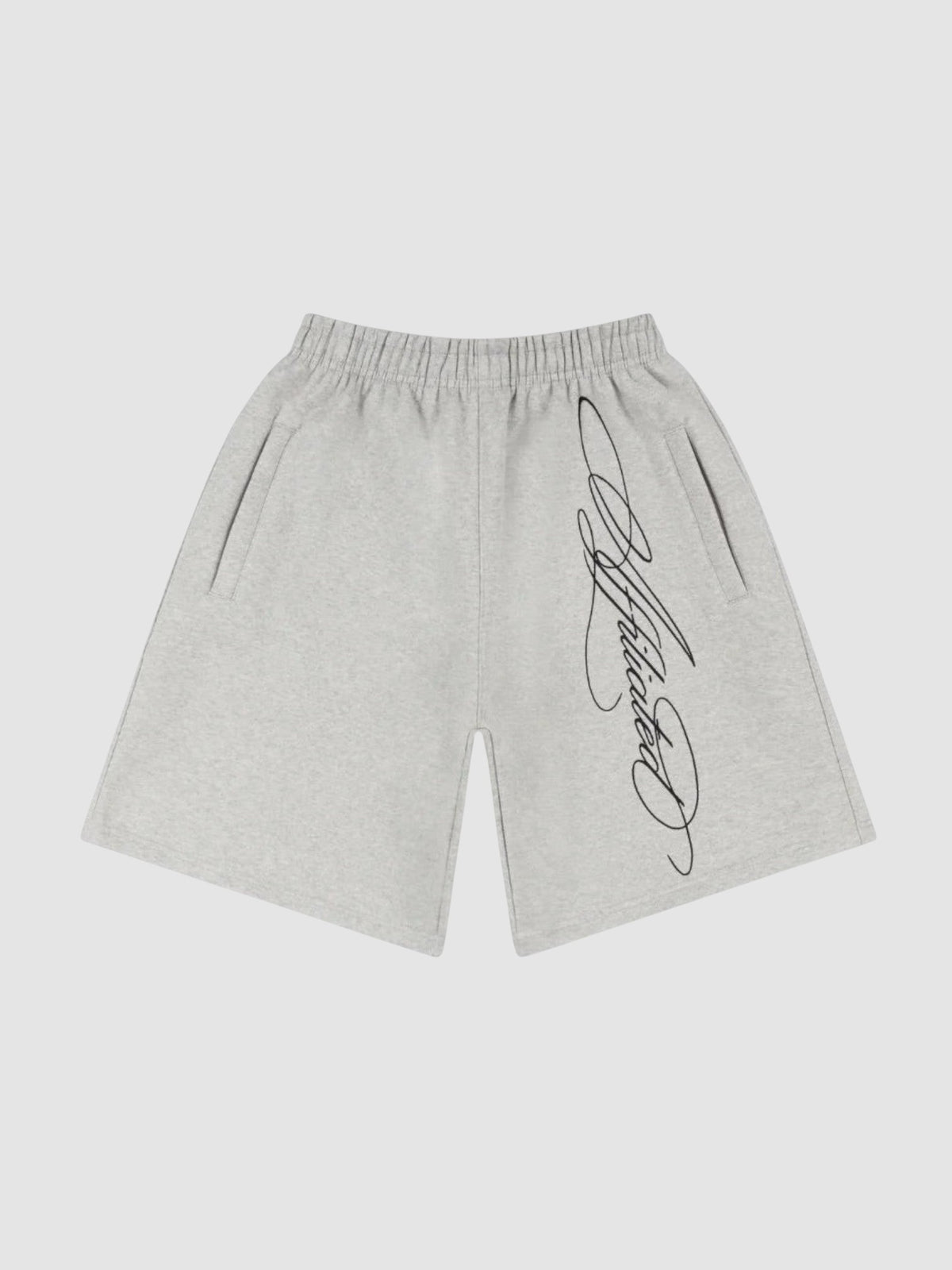 Y2K Studio grey fleece shorts with black cursive calligraphy print, elastic waist, and side pockets.