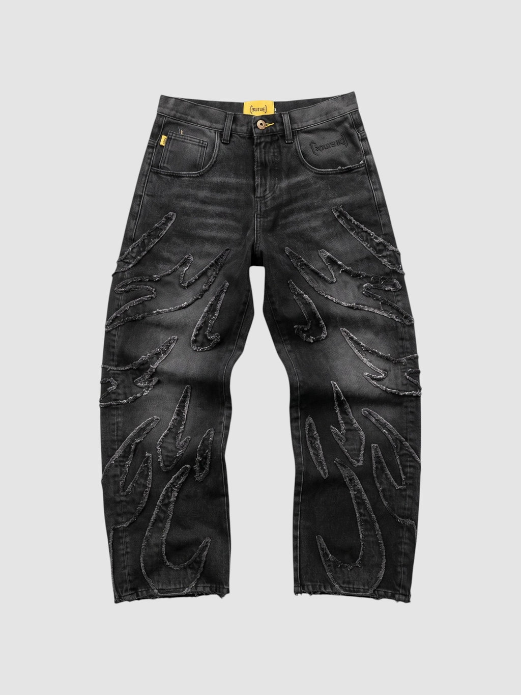 Y2K Studio baggy grey denim jeans featuring raw-edge flame appliqués and a wide-leg fit.