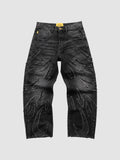 Y2K Studio baggy grey denim jeans featuring raw-edge flame appliqués and a wide-leg fit.