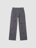 Y2K STUDIO grey washed denim cargo pants for women featuring tonal star prints, large thigh pockets, and low-rise fit.