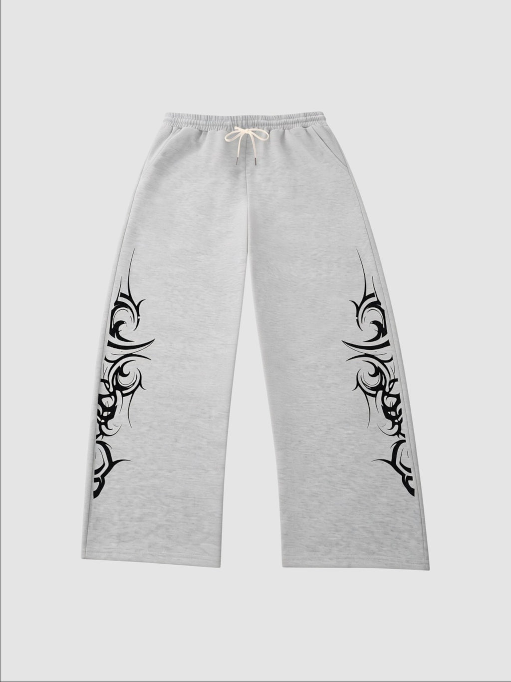 Y2K Studio grey heather wide-leg joggers featuring black tribal graphic prints on the sides and an elastic waistband.