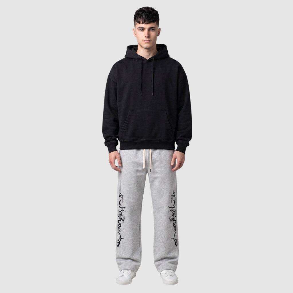Y2K Studio grey heather fleece joggers with black tribal graphic print, wide leg fit, and adjustable drawstring waist
