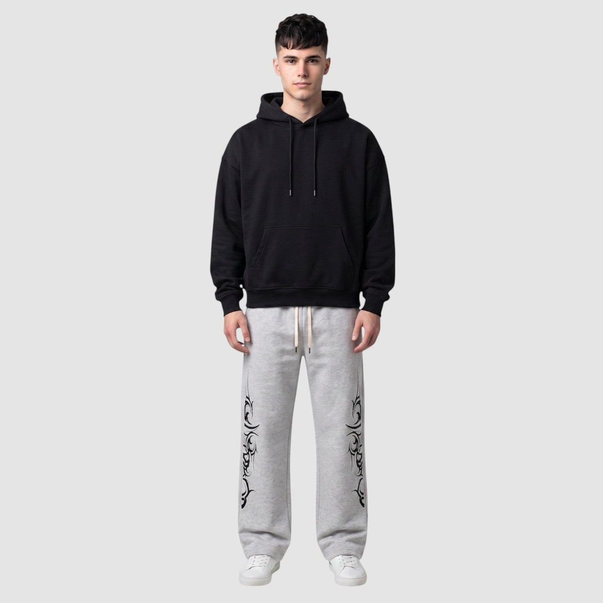 Y2K Studio grey heather fleece joggers with black tribal graphic print, wide leg fit, and adjustable drawstring waist