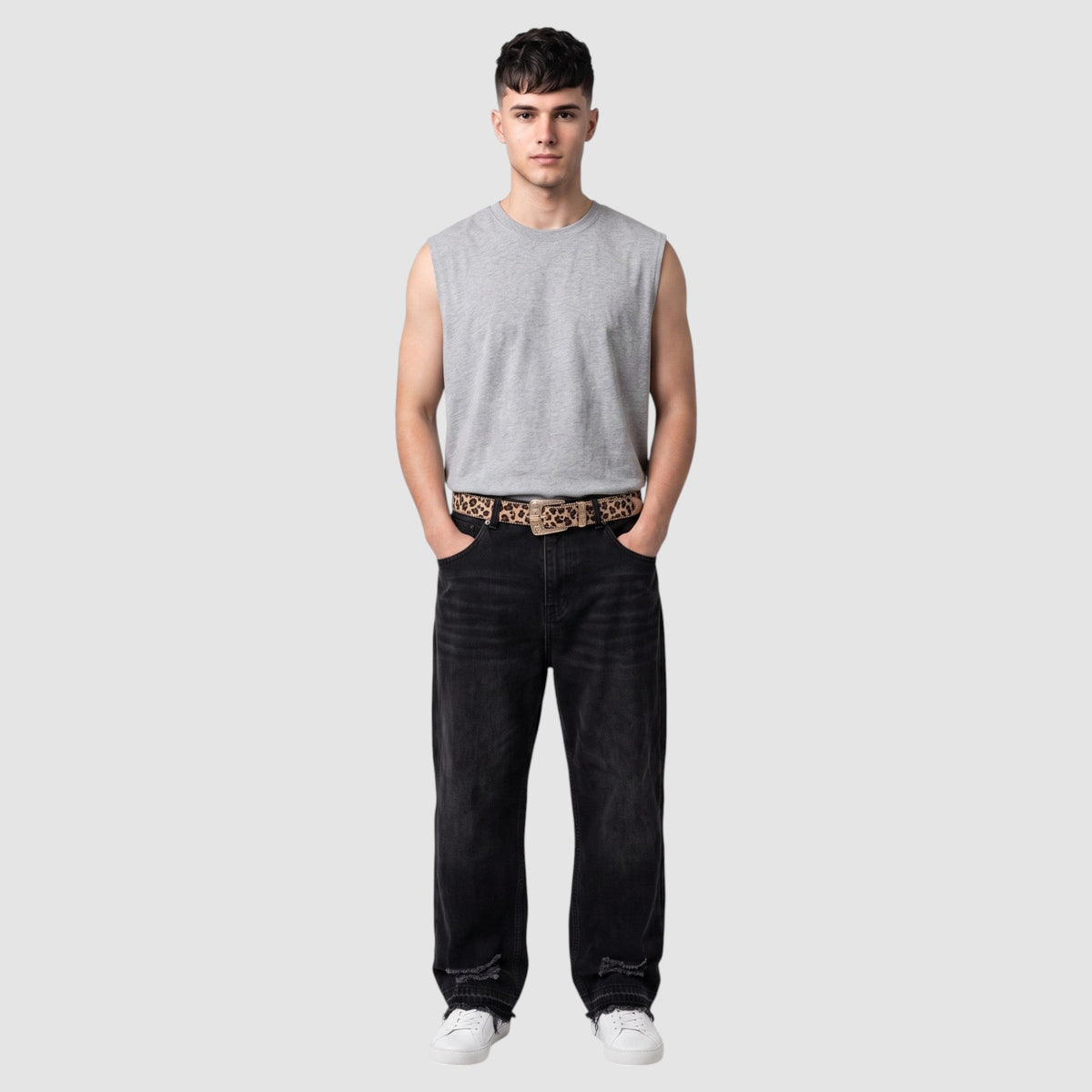 Y2K Studio leopard print belt with western buckle and silver conchos worn by a man in a grey tank top and black jeans