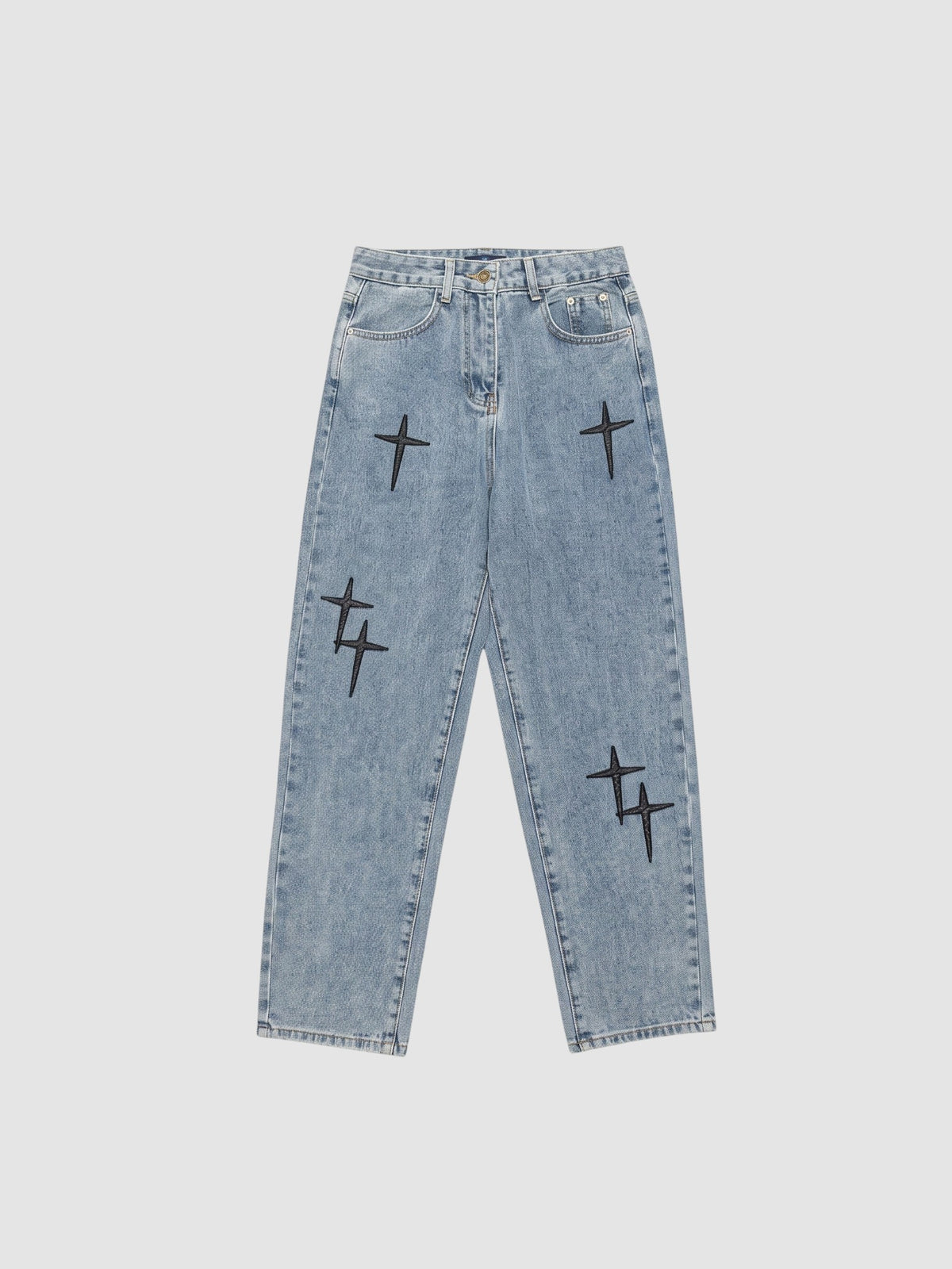 Y2K Studio light wash denim jeans for men featuring black embroidered cross patterns and a relaxed straight fit.