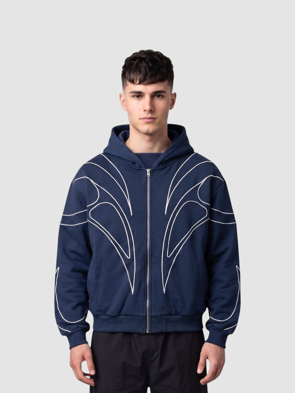 Y2K Studio navy blue zip-up hoodie with white symmetrical curved line graphics, featuring a cropped, oversized fit.