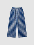 Y2K Studio wide-leg plaid trousers in navy blue and white with an elasticated drawstring waist and side pockets.