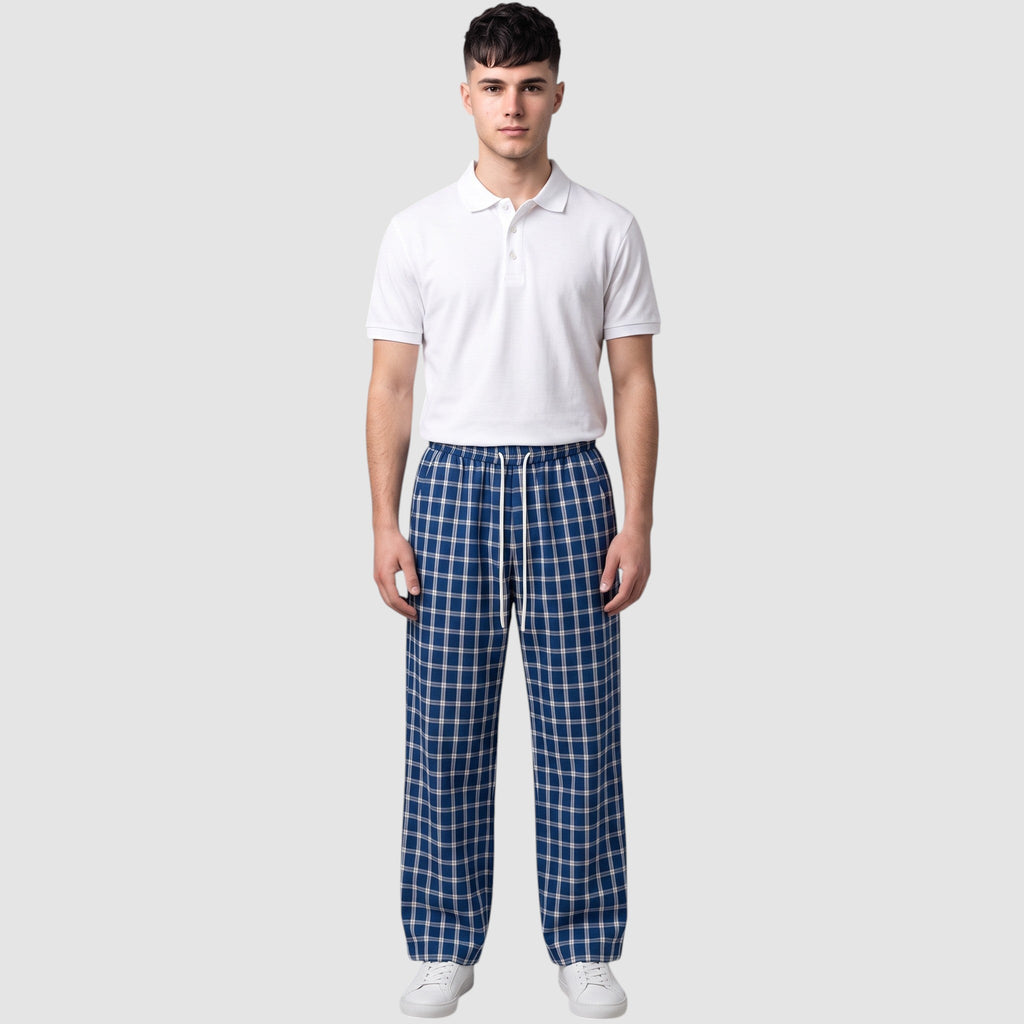 Y2K Studio wide-leg plaid trousers in navy and white with an elastic drawstring waist worn by a male model