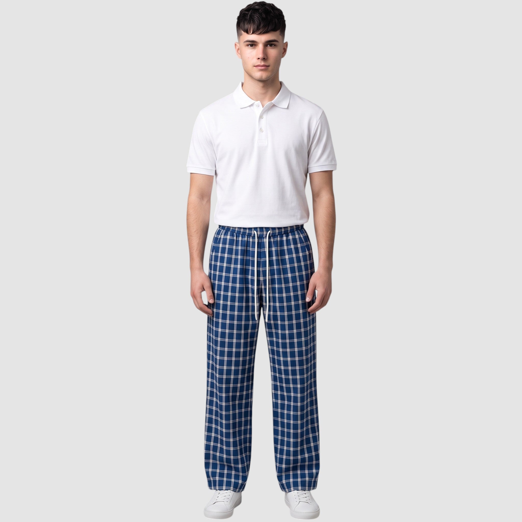 Y2K Studio wide-leg plaid trousers in navy and white with an elastic drawstring waist worn by a male model