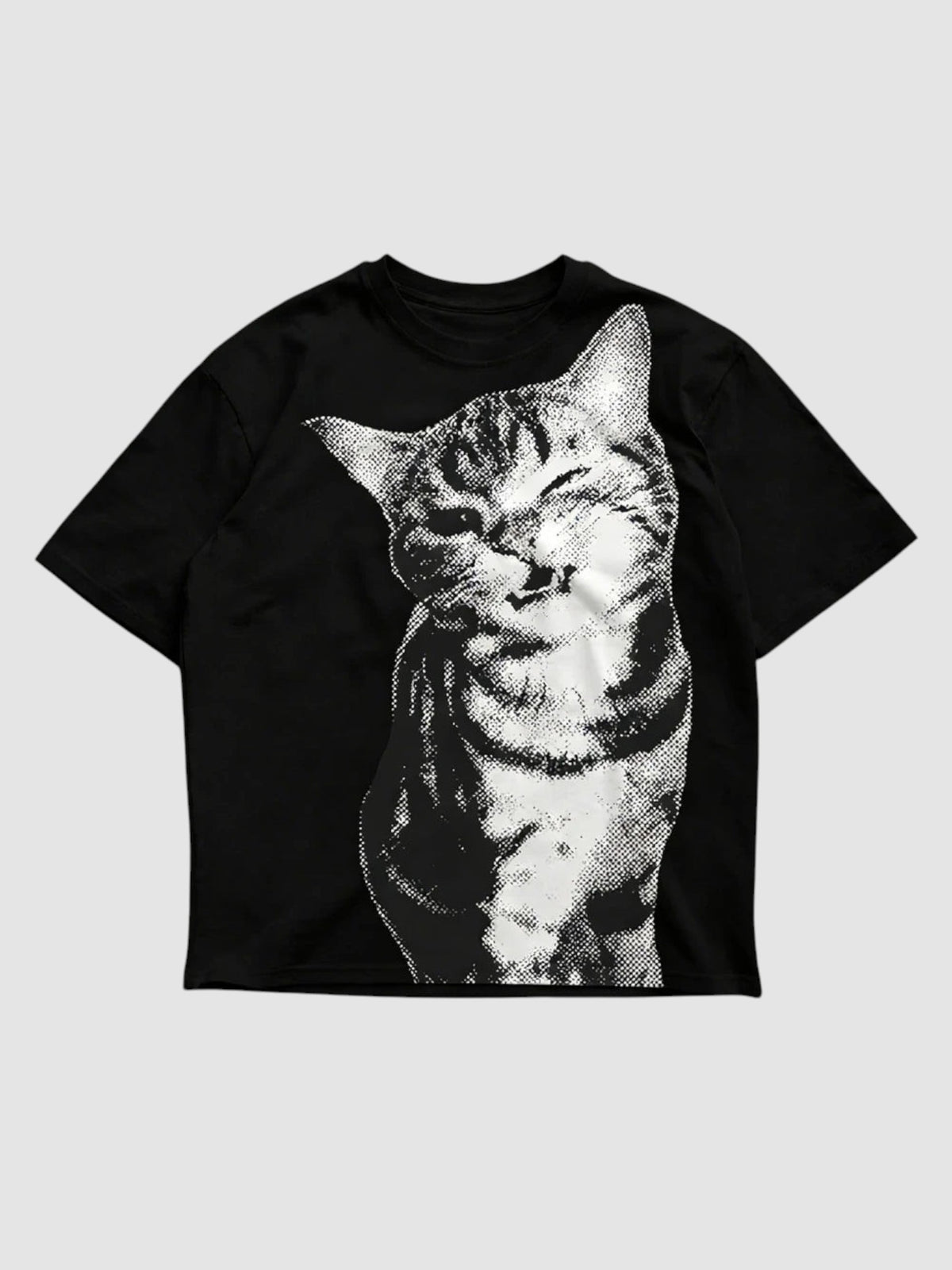 Y2K Studio oversized black t-shirt featuring a white halftone cat portrait graphic with a winking expression.