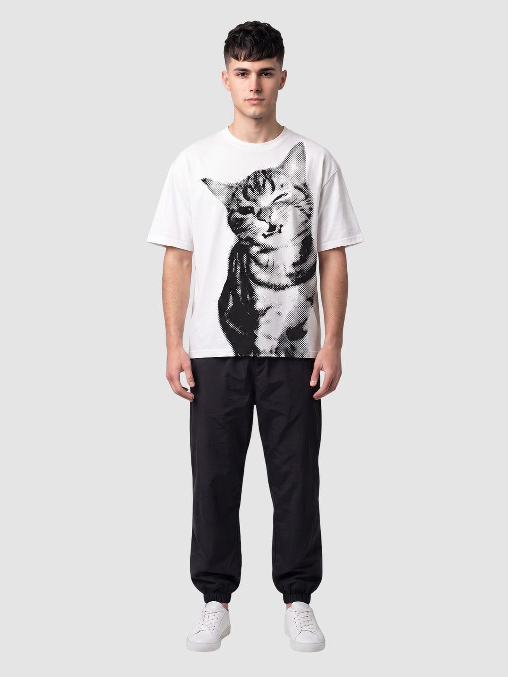 Y2K Studio white oversized t-shirt featuring a black halftone cat portrait print worn by a male model