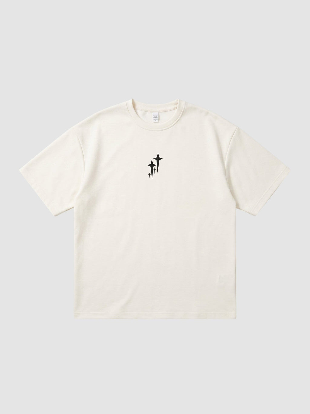 Y2K Studio oversized cream polyester t-shirt with a small black star graphic on the chest and ribbed crew neck.