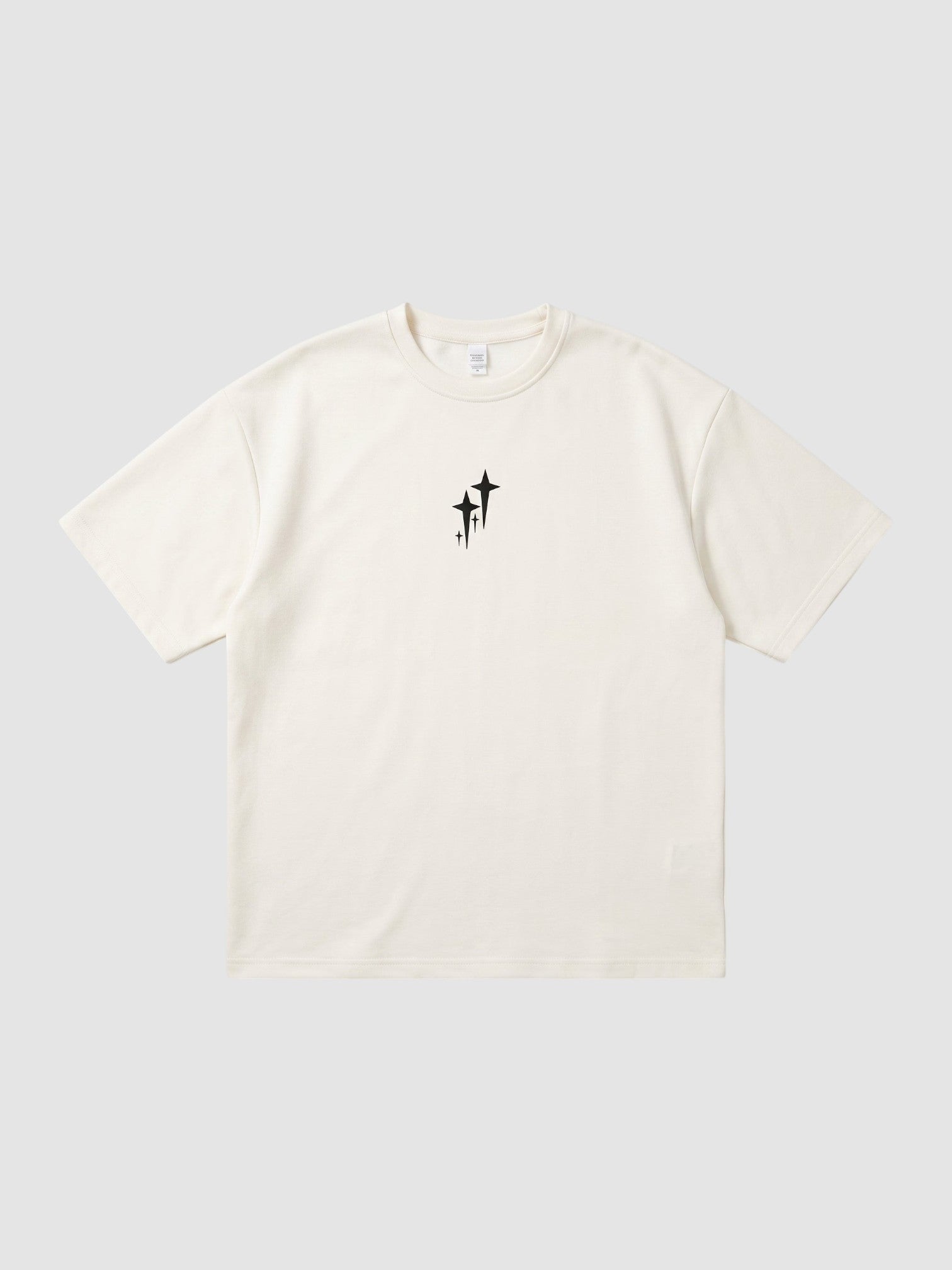 Y2K Studio oversized cream polyester t-shirt with a small black star graphic on the chest and ribbed crew neck.