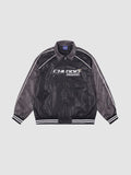 Y2K Studio oversized motorcycle jacket in black and charcoal with white piping, graphic print, and ribbed cuffs.
