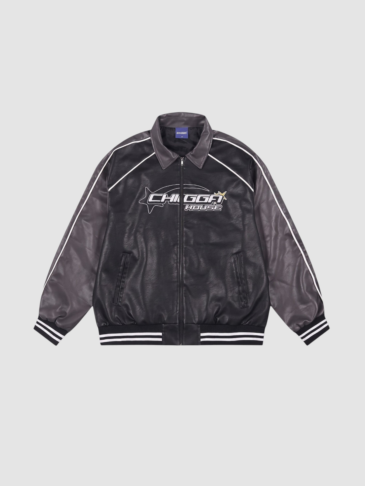 Y2K Studio oversized motorcycle jacket in black and charcoal with white piping, graphic print, and ribbed cuffs.