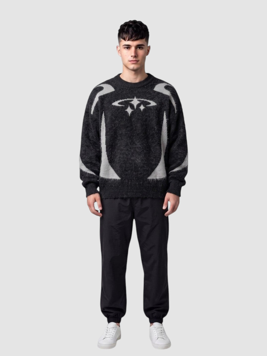 Y2K Studio oversized anthracite knit sweater with light grey star embroidery and curved patterns on a male model