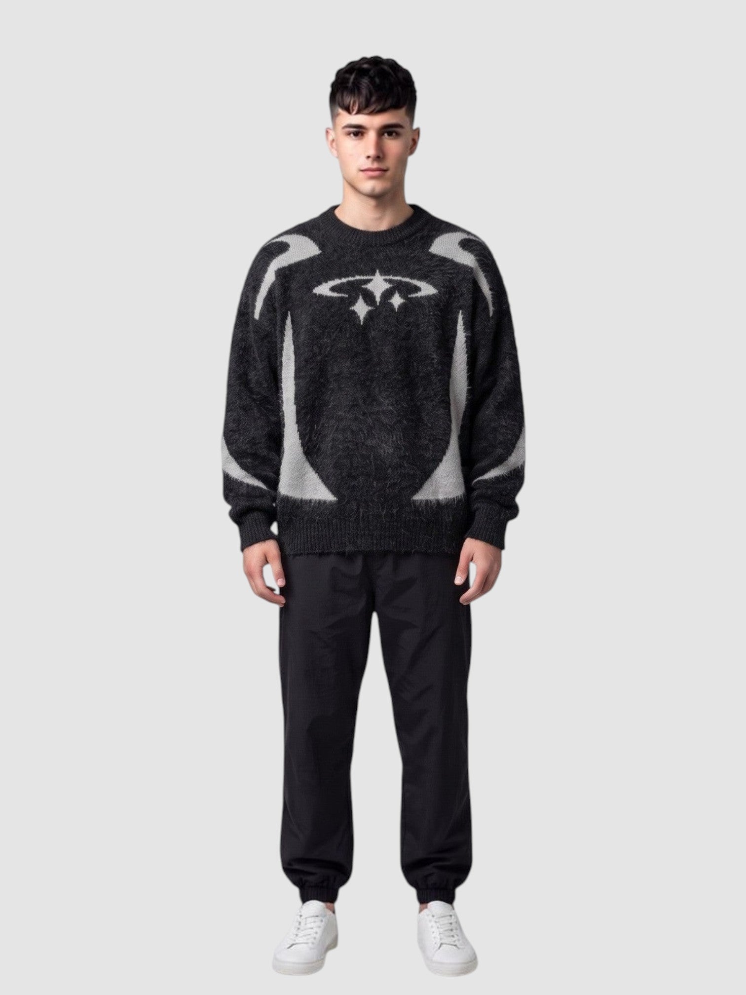 Y2K Studio oversized anthracite knit sweater with light grey star embroidery and curved patterns on a male model