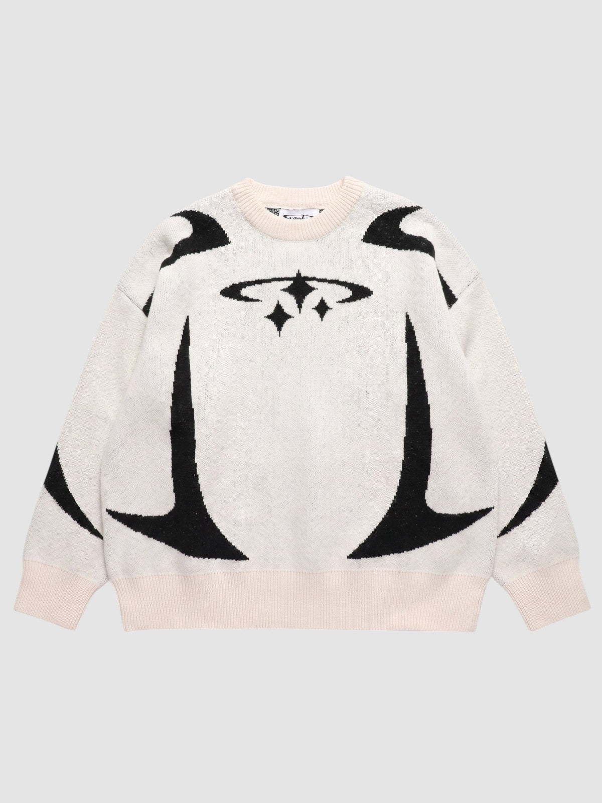 Y2K STUDIO oversized knit sweater in cream with black star and curved graphic patterns and ribbed crew neck