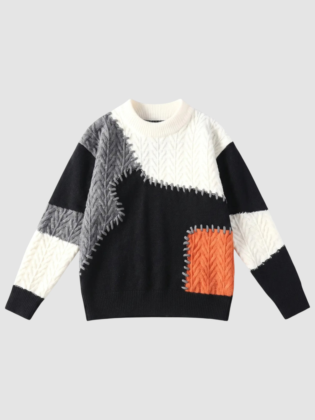 Y2K Studio patchwork knit sweater featuring off-white, black, and orange textured panels with decorative whipstitching.