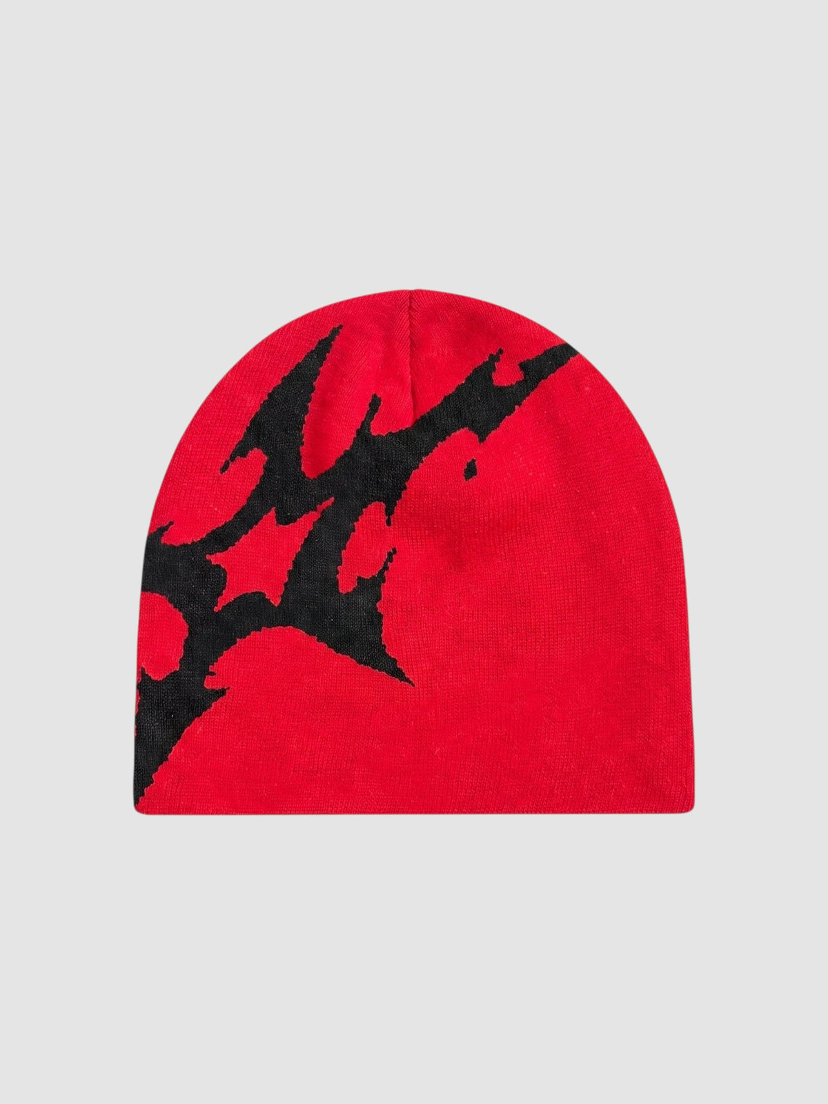 Y2K Studio red acrylic beanie with an asymmetrical black lightning bolt graphic pattern in a Y2K streetwear style.