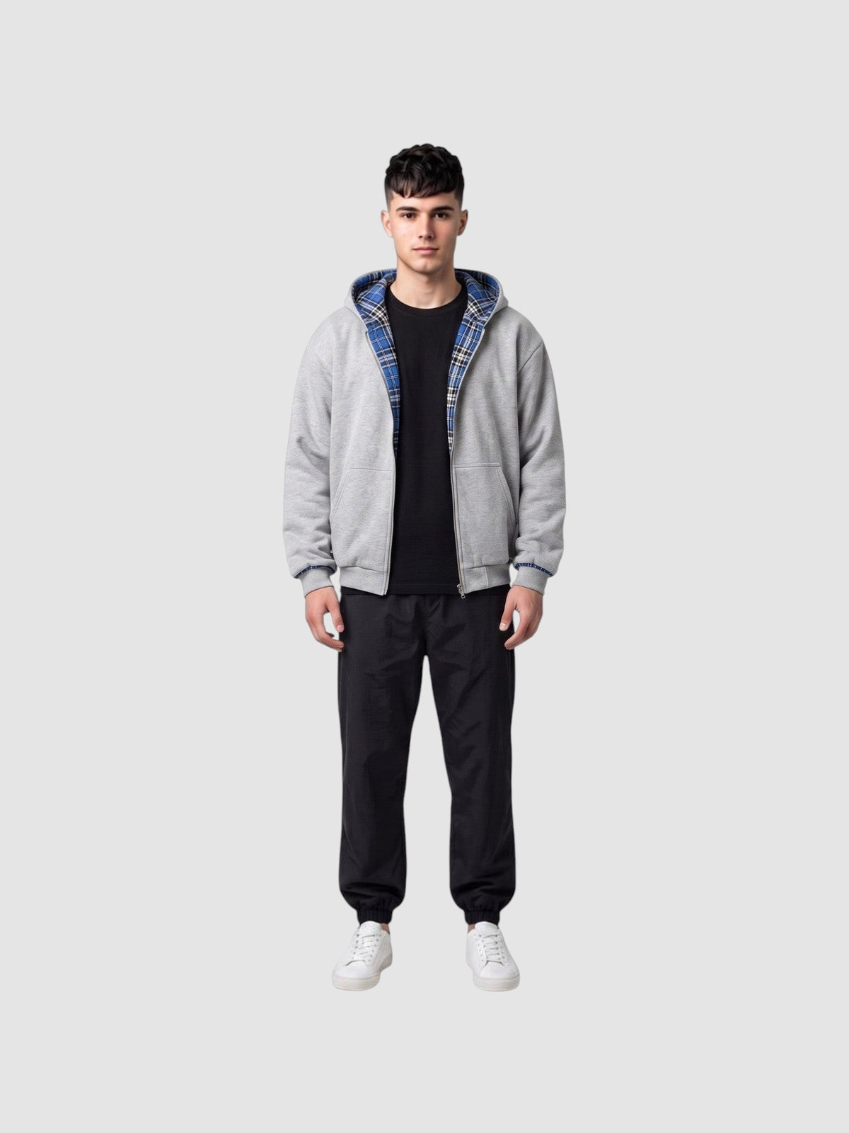 Y2K STUDIO reversible grey cotton zip-up hoodie with blue and black tartan lining worn by a male model