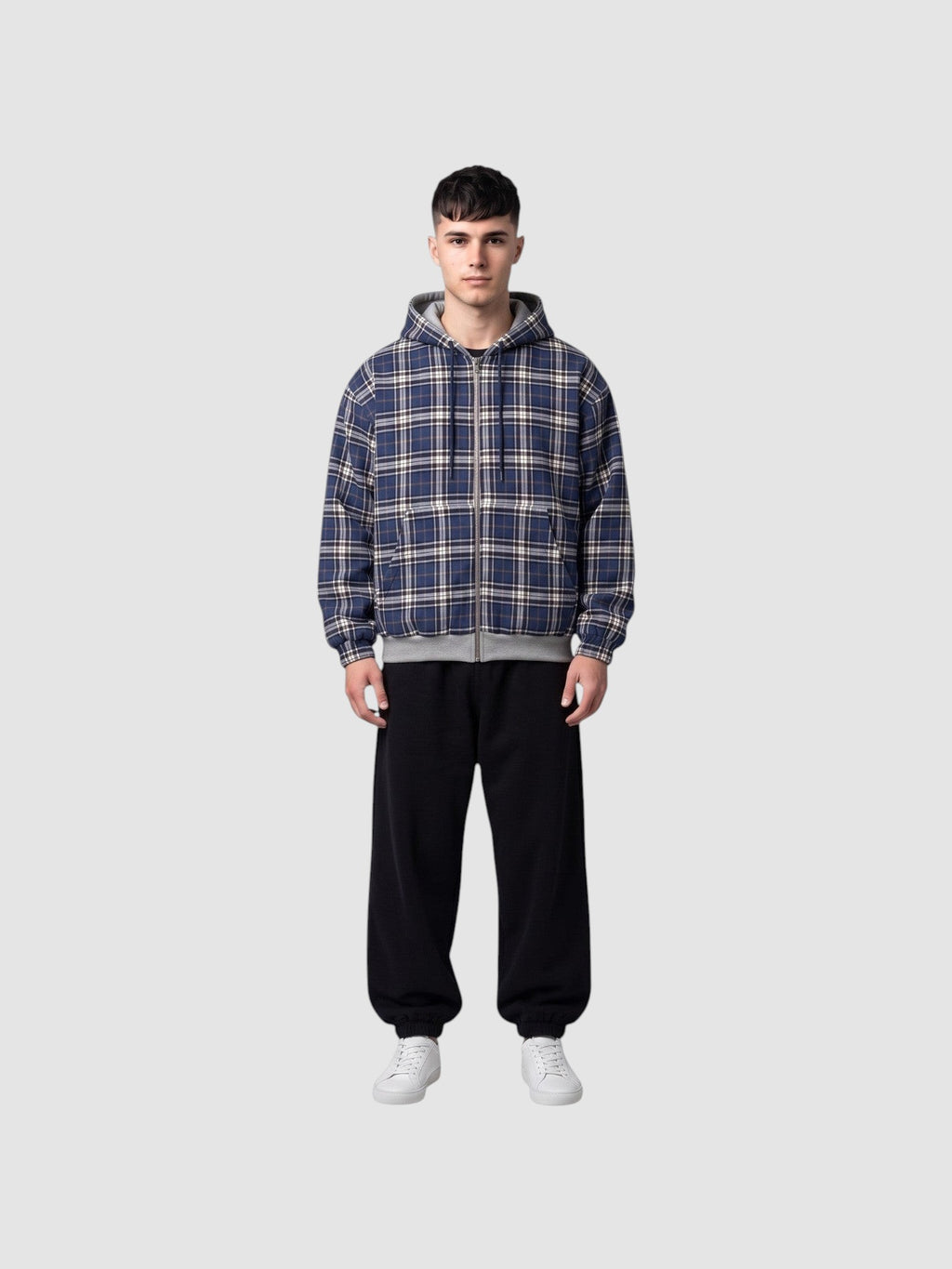 Y2K STUDIO reversible zip-up hoodie featuring a blue, white, and black tartan plaid pattern on a male model.