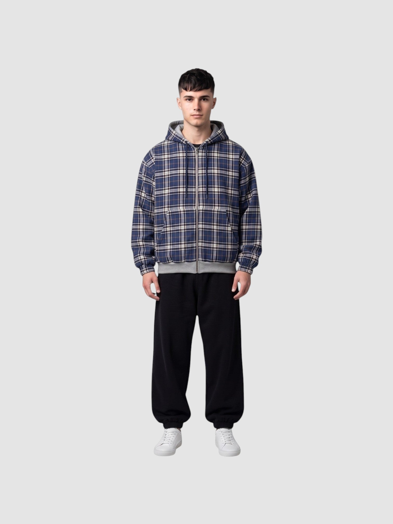 Y2K STUDIO reversible zip-up hoodie featuring a blue, white, and black tartan plaid pattern on a male model.