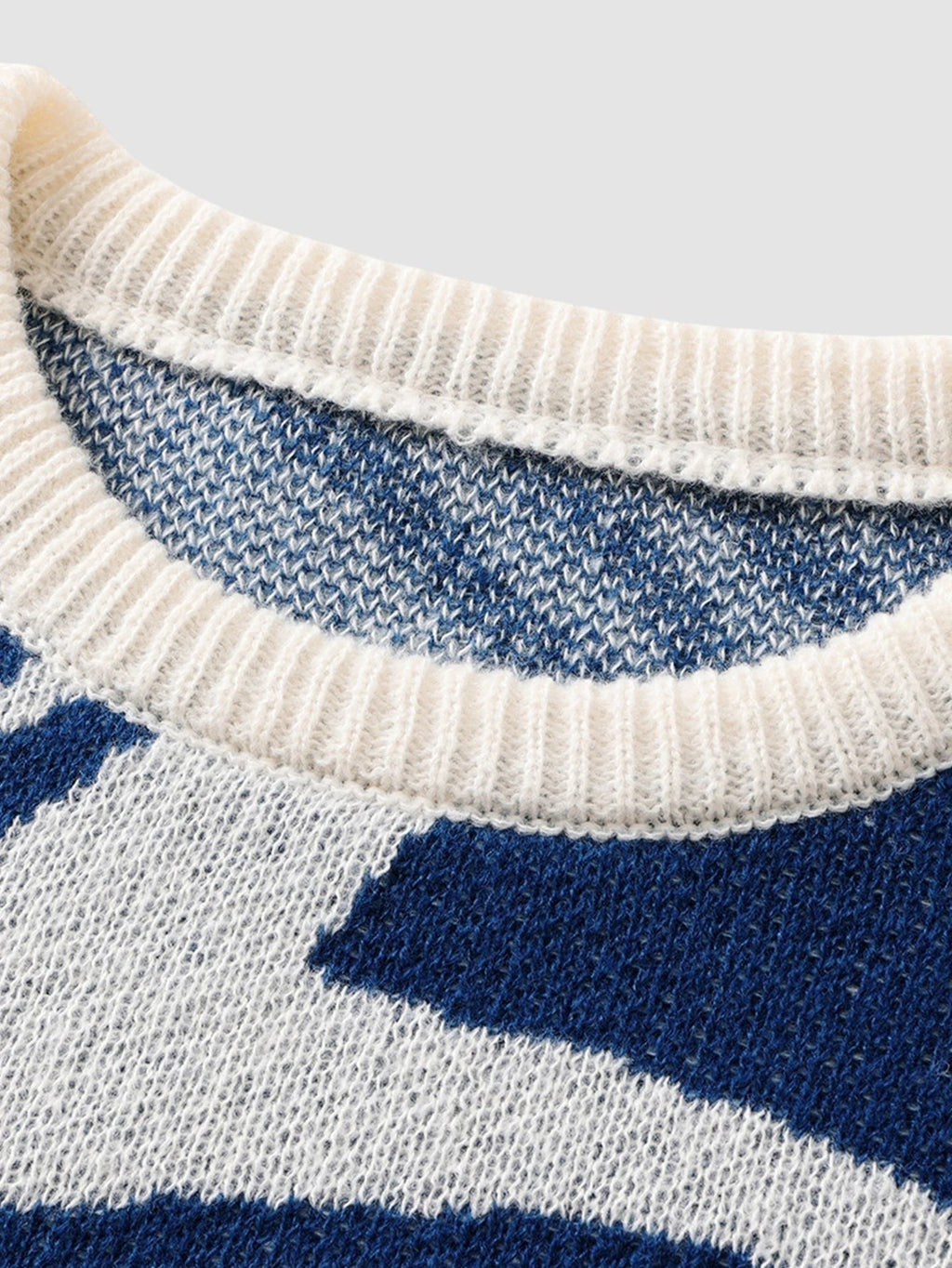 Y2K STUDIO navy and off-white spiral pattern knit sweater with a ribbed crew neck collar