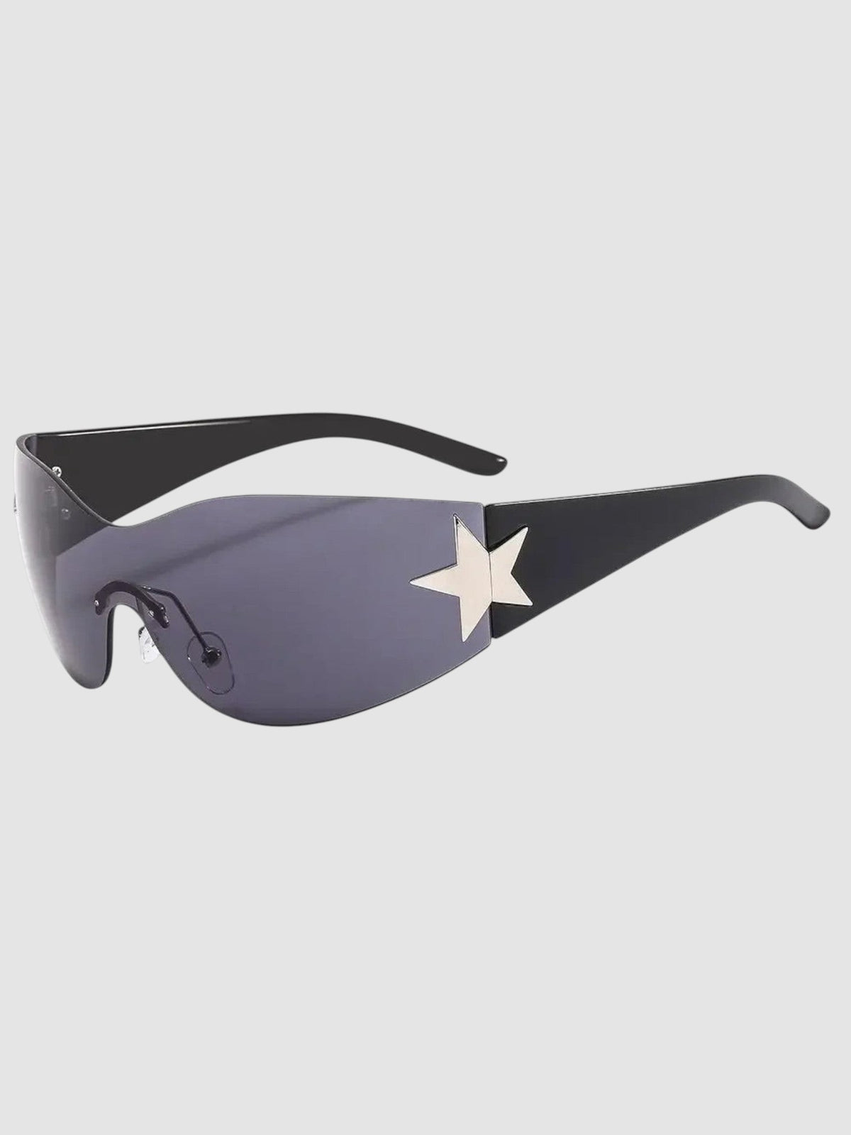 Y2K Studio star mask sunglasses with a frameless black visor lens and silver star detail on the temple.