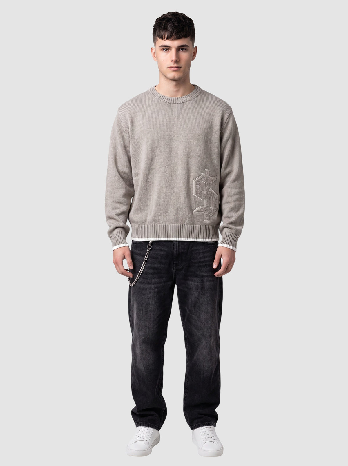 Y2K Studio taupe grey cotton knit sweater with gothic dollar patch, ribbed crew neck, and white trim details.