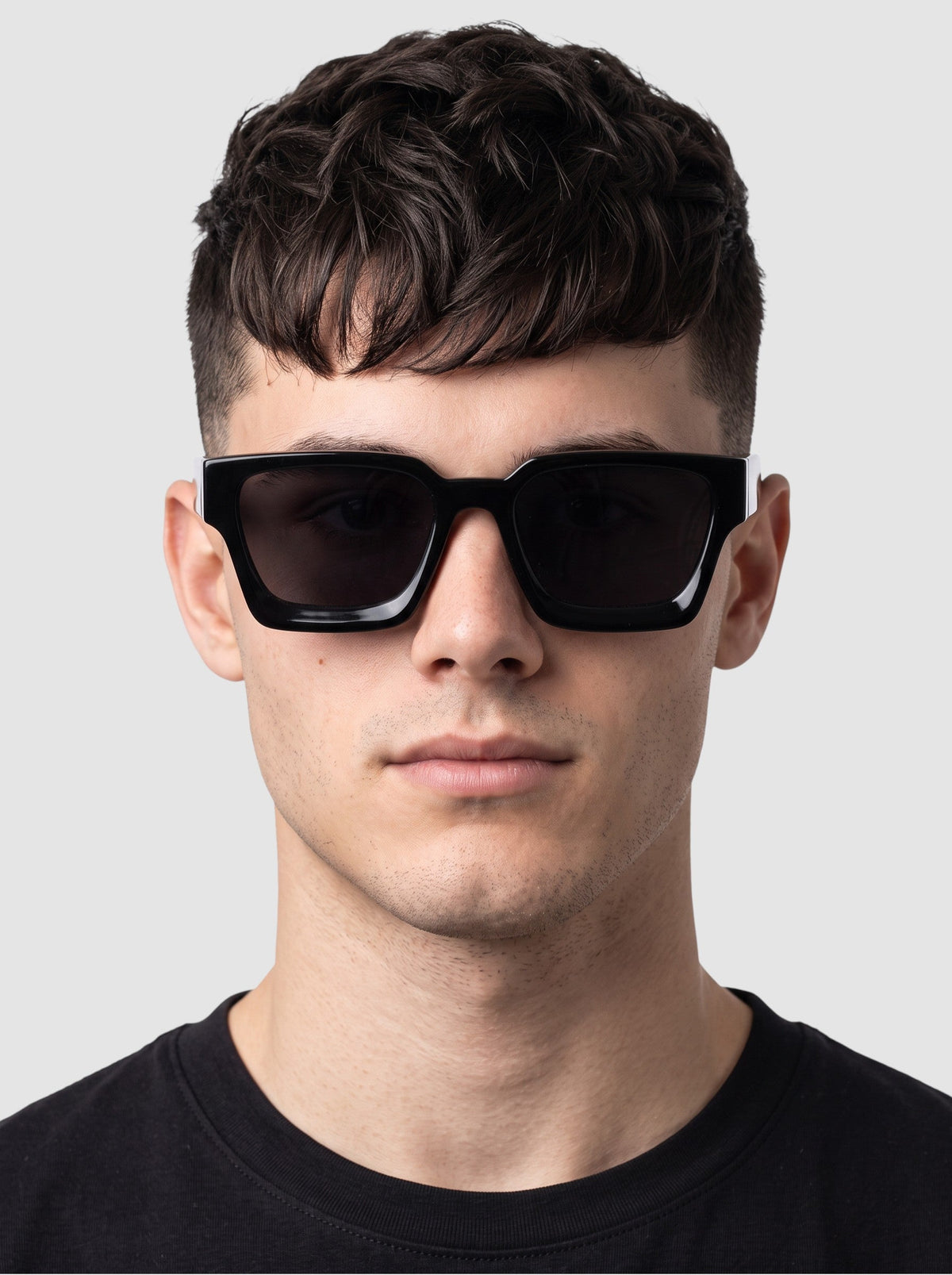 Y2K Studio thick rectangular black sunglasses with UV400 polycarbonate lenses worn by a man against a white background