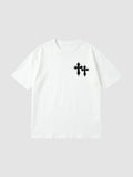 Y2K Studio white oversized cotton t-shirt with black gothic cross graphic on the chest and ribbed crew neck.
