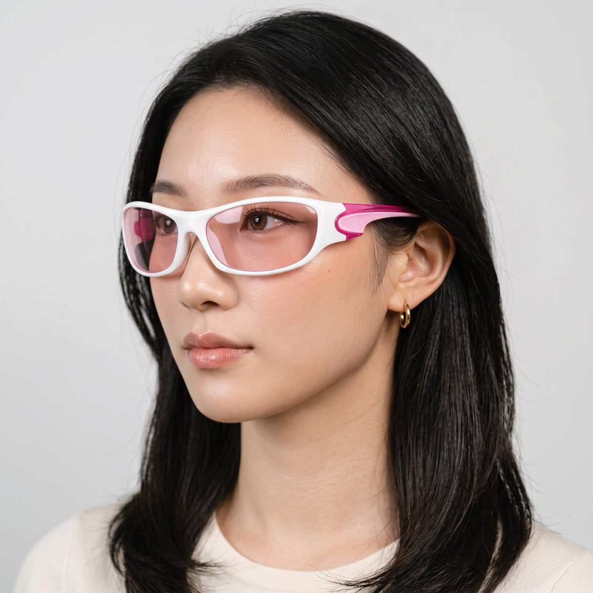 Y2K STUDIO wraparound sport sunglasses with white frame and pink accents worn by a model