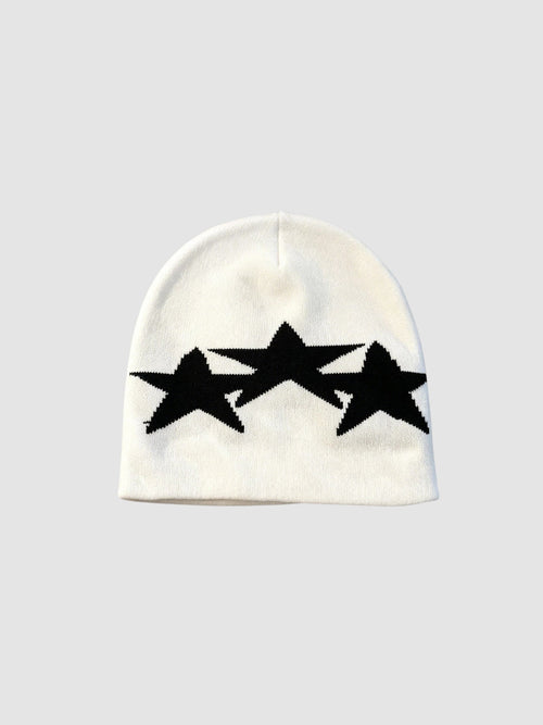 Y2K Studio white acrylic beanie featuring three overlapping black star motifs in a graphic Y2K style