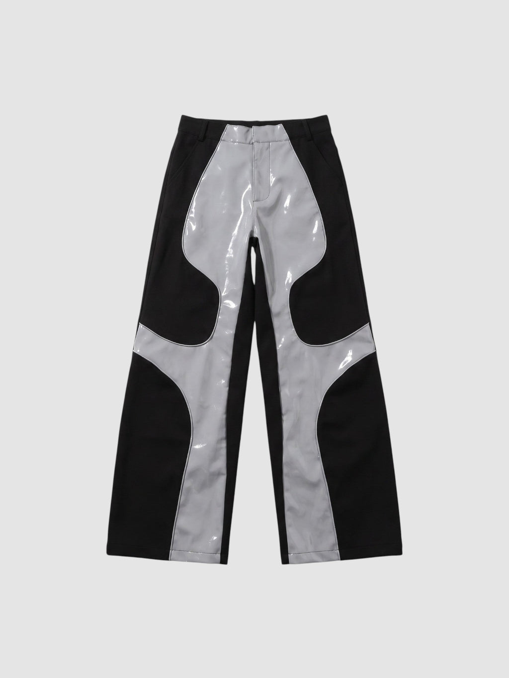 Y2K STUDIO wide leg faux leather trousers in black and glossy light grey with wavy wave-cut panel detailing.