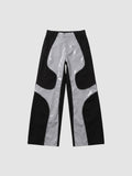Y2K STUDIO wide leg faux leather trousers in black and glossy light grey with wavy wave-cut panel detailing.