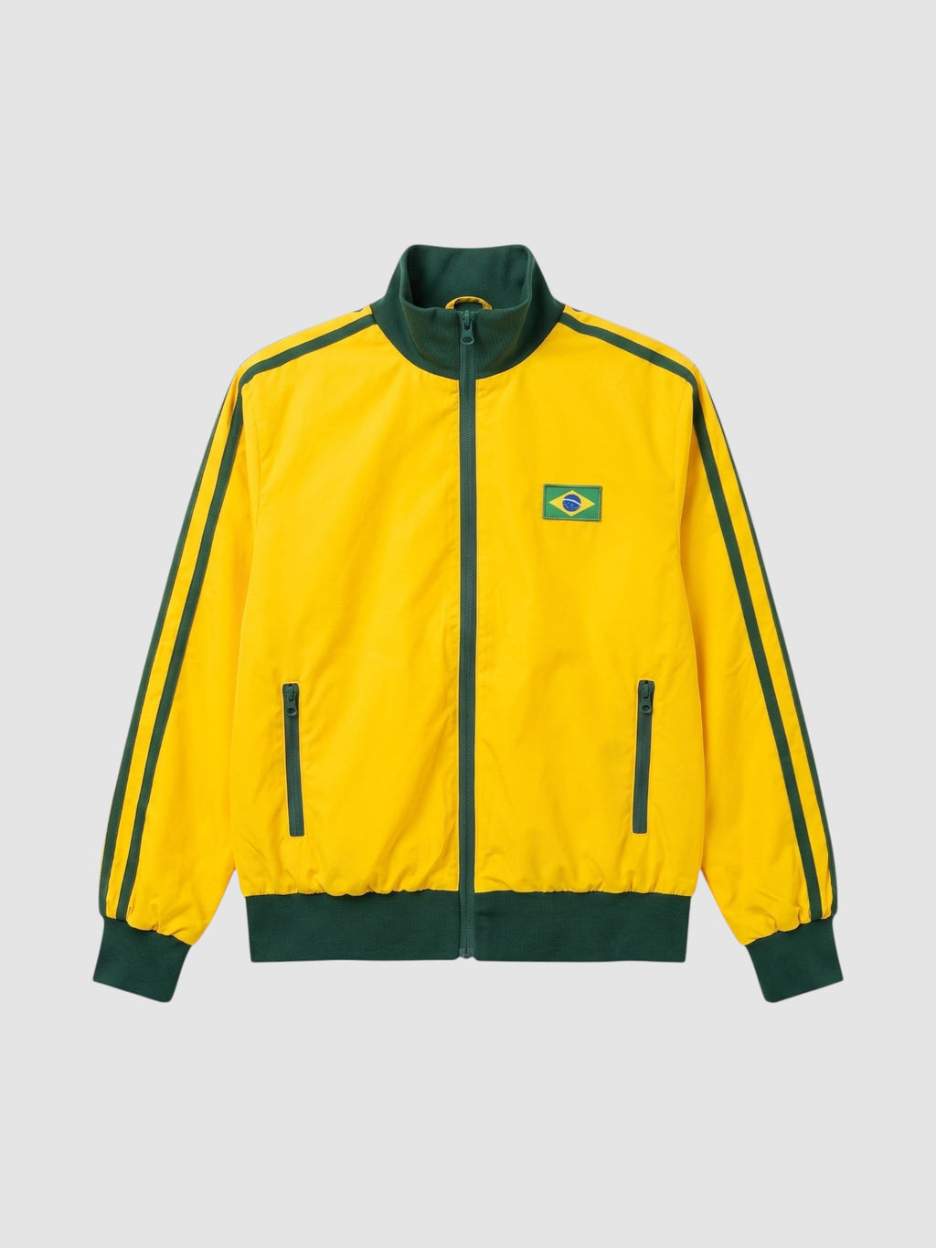 Y2K Studio yellow and green Brazil track jacket with a high collar, side zip pockets, and a national flag patch.