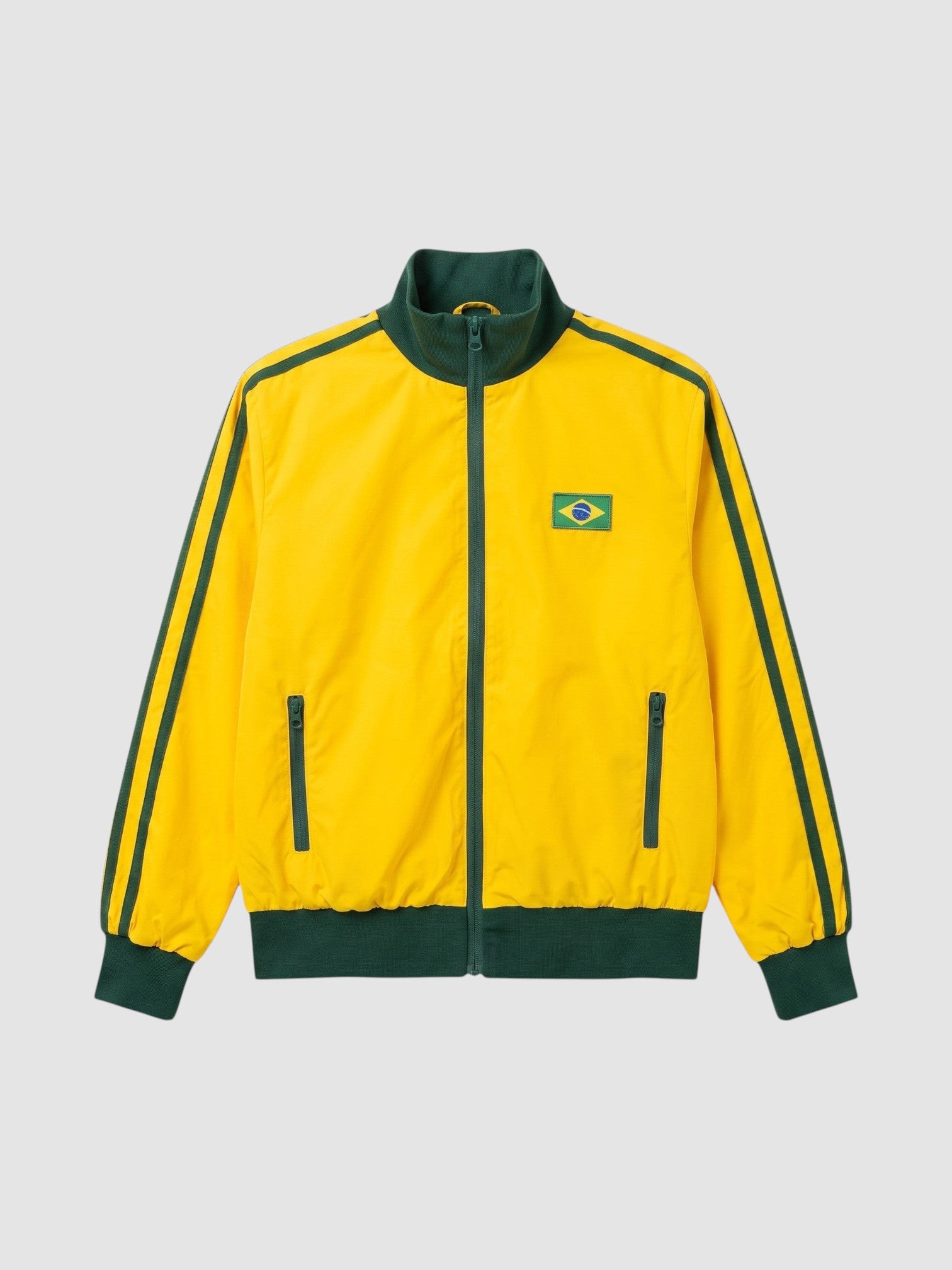 Y2K Studio yellow and green Brazil track jacket with a high collar, side zip pockets, and a national flag patch.
